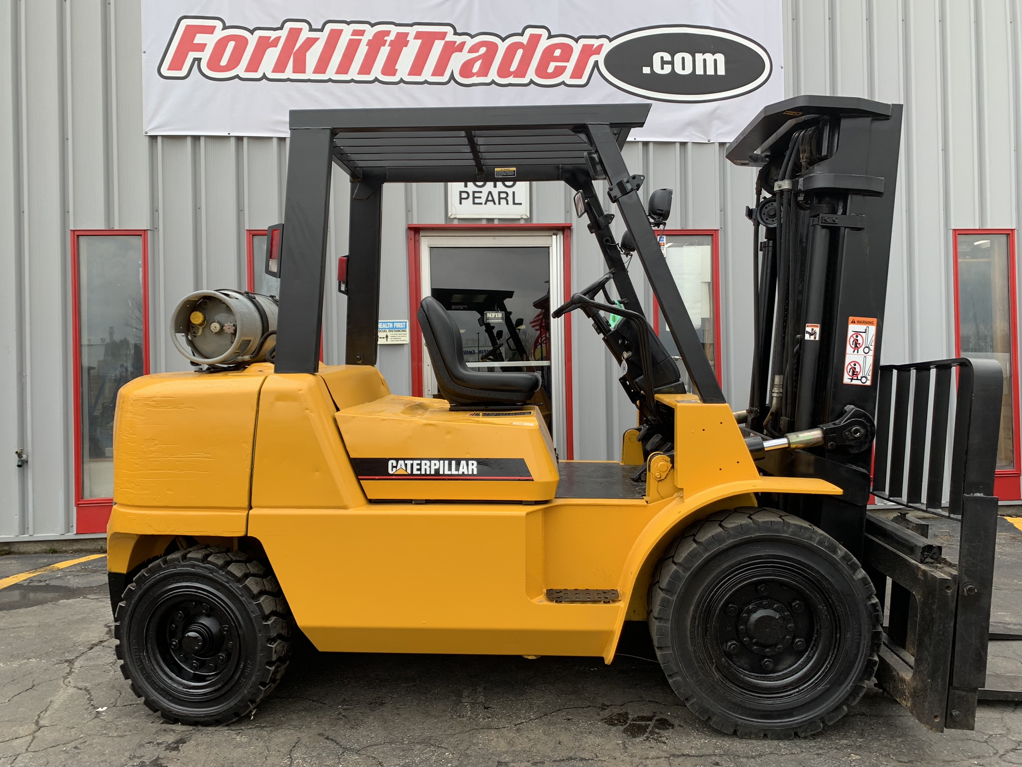 Yellow caterpillar forklift with all new solid pneumatic tires