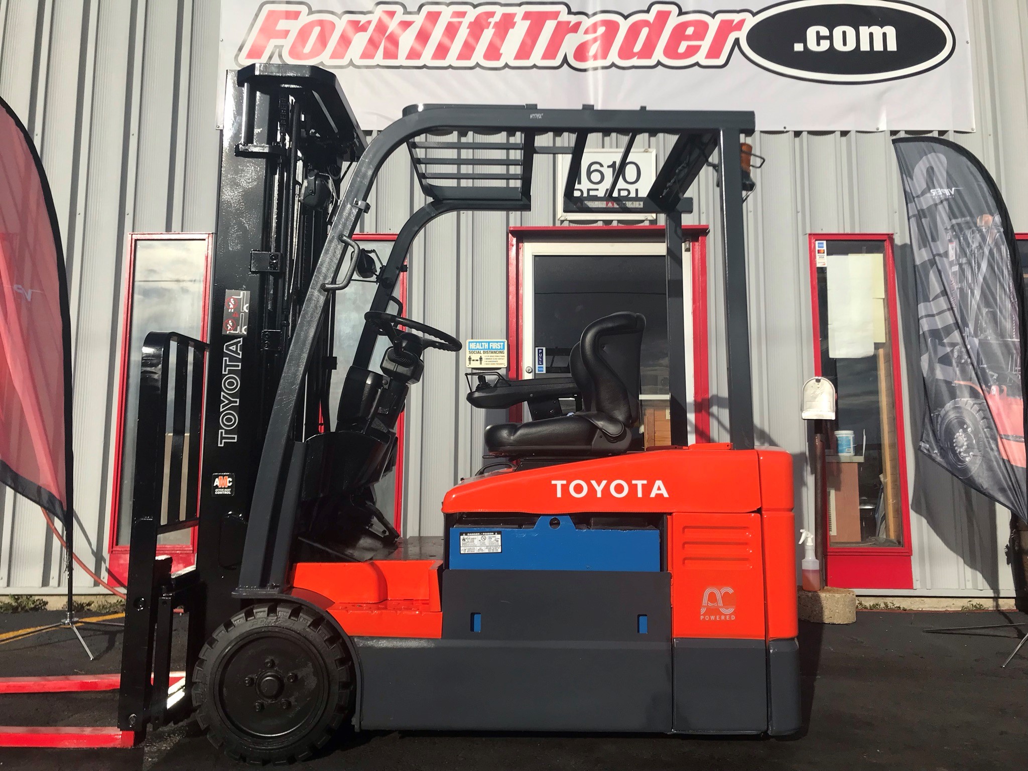Orange toyota forklift with 189" lift height for rent