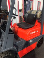 Orange toyota forklift with 5,000lb capacity for rent